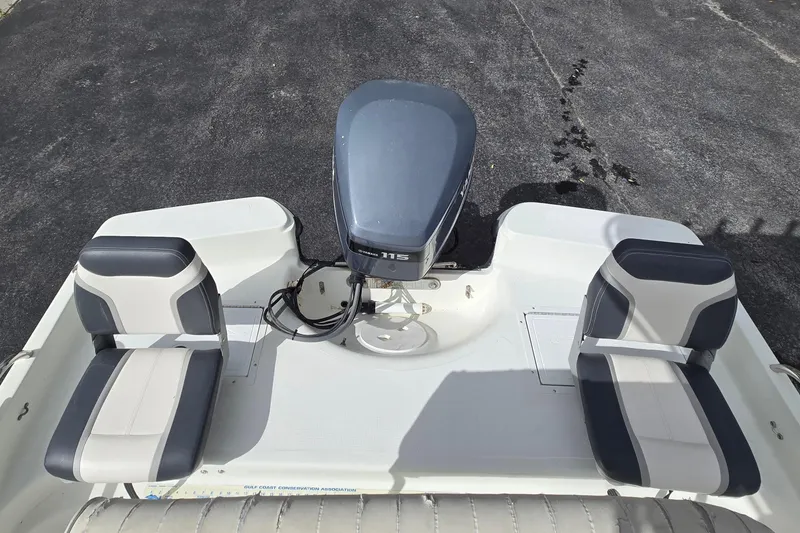 Slide: The Image of 2001 VIP 1880 BAY STEALTH boat with dual seats and outboard motor. - 14