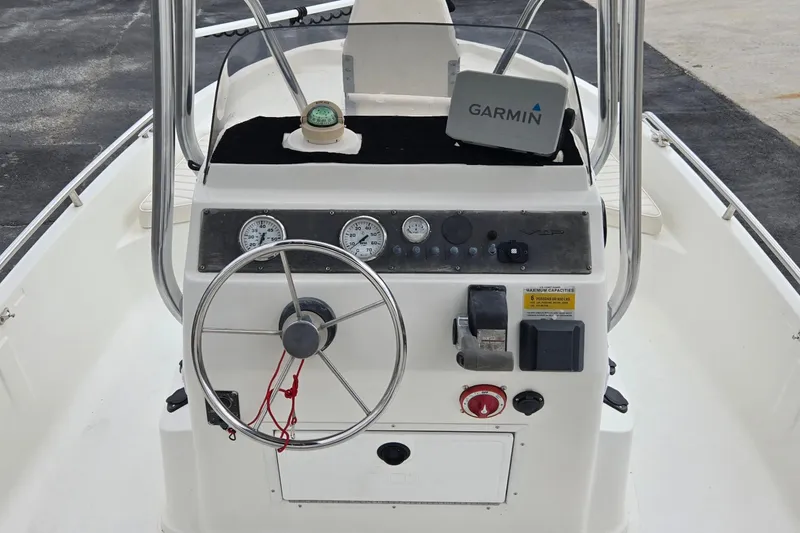 Slide: The Image of 2001 VIP 1880 BAY STEALTH boat console with Garmin GPS and steering wheel. - 15