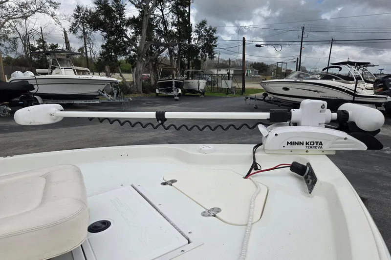 Slide: The Image of 2001 VIP 1880 BAY STEALTH boat with Minn Kota Terrova trolling motor in a parking lot. - 17