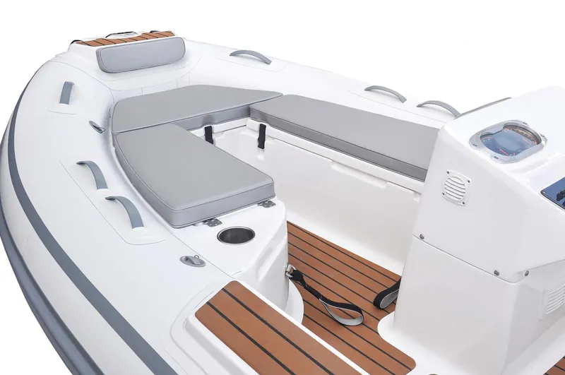 Slide: The Image of Manufacturer Provided Image: Interior view of AB Inflatables ABJET 465XP 2026 with gray cushions. - 3