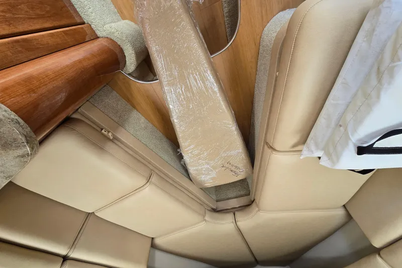Slide: The Image of Interior view of 2017 Formula 310 Sun Sport boat with beige seating and wooden accents. - 105