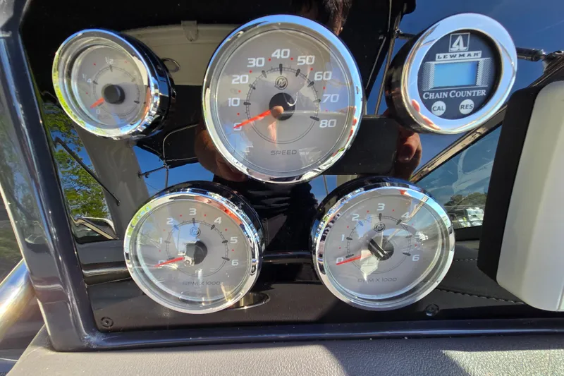 Slide: The Image of Dashboard gauges of a 2017 Formula 310 Sun Sport boat. - 106