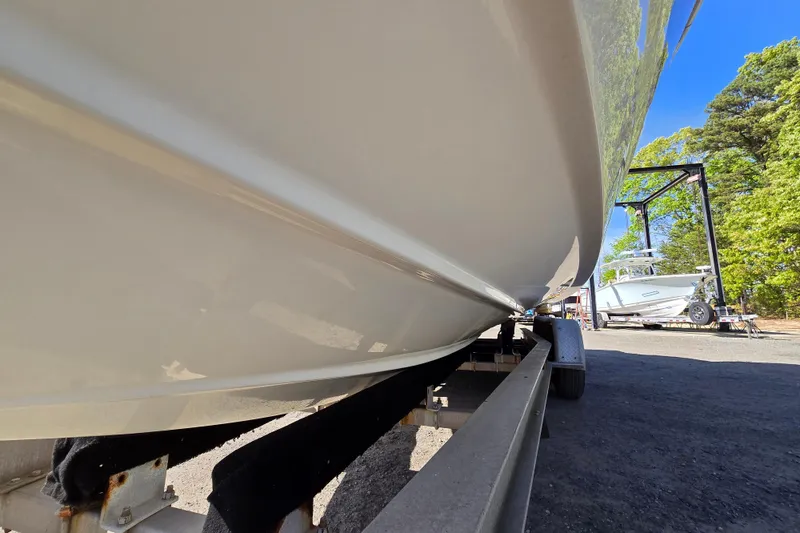 Slide: The Image of 2017 Formula 310 Sun Sport boat on trailer, side view, outdoors. - 110