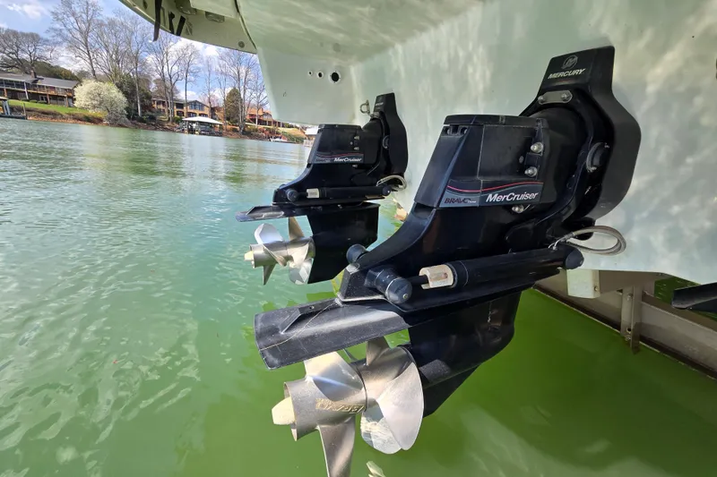 Slide: The Image of 2017 Formula 310 Sun Sport boat with MerCruiser Bravo Three outdrives on a lake. - 12