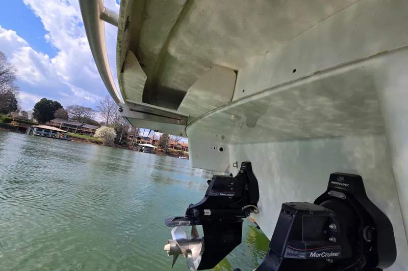 Slide: The Image of 2017 Formula 310 Sun Sport boat with MerCruiser engines on a calm lake. - 13