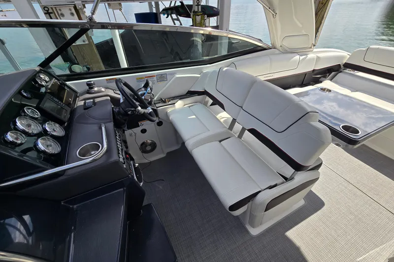 Slide: The Image of 2017 Formula 310 Sun Sport boat interior with sleek dashboard and comfortable seating. - 21