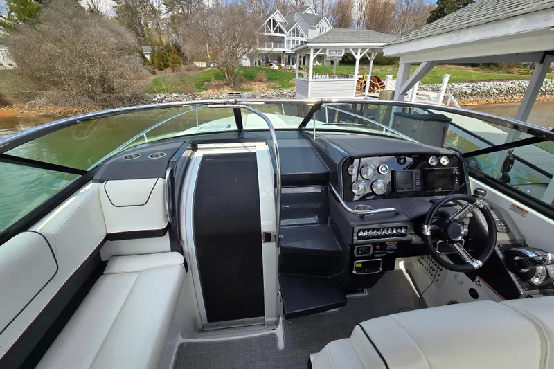 Slide: The Image of 2017 Formula 310 Sun Sport boat interior with sleek dashboard and comfortable seating. - 22