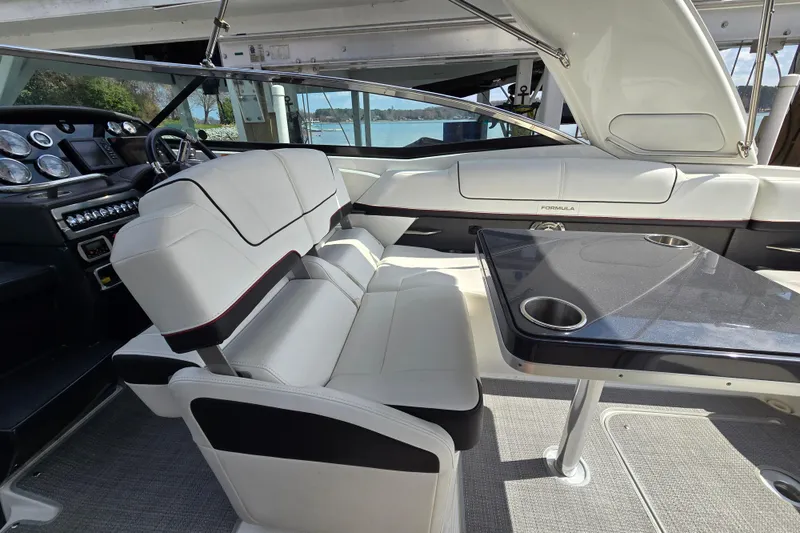 Slide: The Image of 2017 Formula 310 Sun Sport interior with sleek seating and modern dashboard. - 25