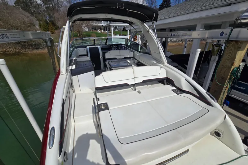 Slide: The Image of 2017 Formula 310 Sun Sport boat with spacious seating and sleek design at a dock. - 26