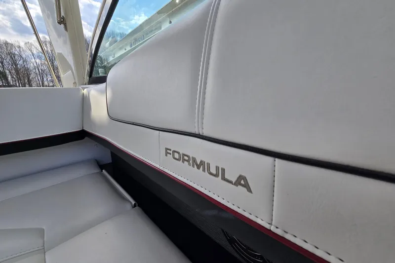 Slide: The Image of 2017 Formula 310 Sun Sport boat interior with white leather seating and logo detail. - 30