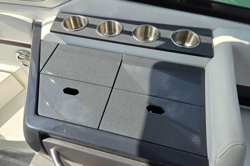 Slide: The Image of 2017 Formula 310 Sun Sport boat interior with cup holders and storage compartments. - 33