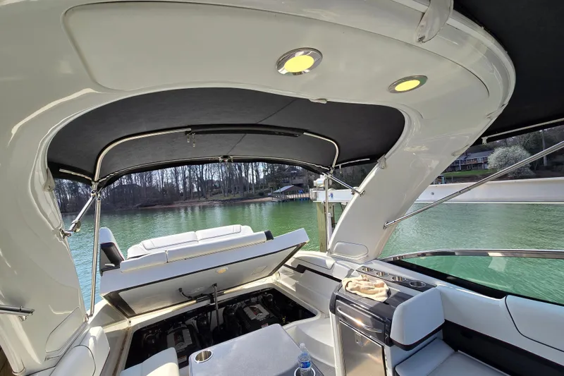 Slide: The Image of 2017 Formula 310 Sun Sport boat interior with open engine compartment, lake view. - 38