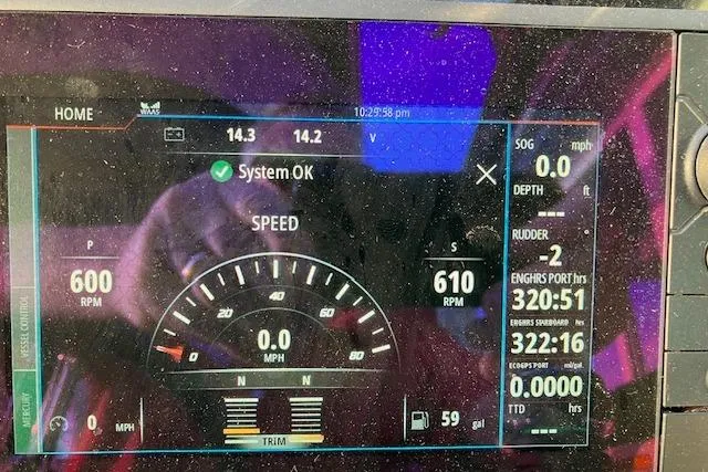 Slide: The Image of Dashboard display of a 2017 Formula 310 Sun Sport boat showing speed and system status. - 46