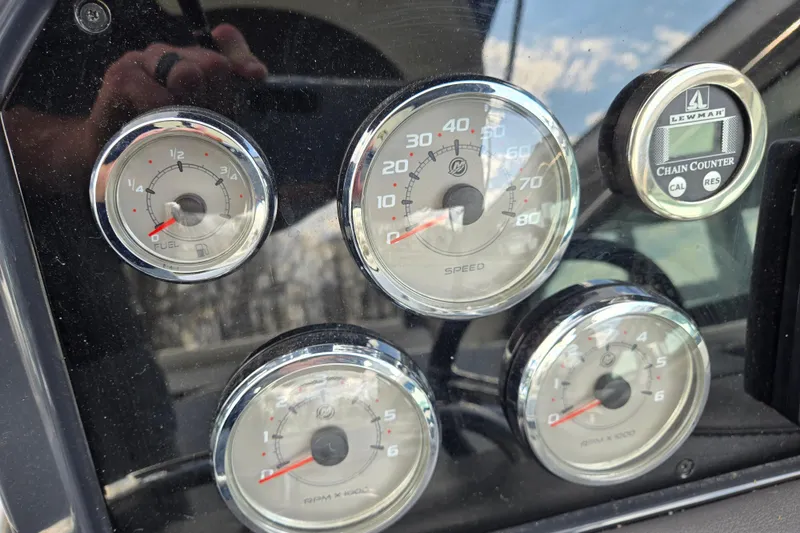 Slide: The Image of Dashboard of a 2017 Formula 310 Sun Sport boat with gauges and chain counter. - 49