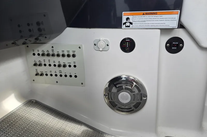 Slide: The Image of Control panel of a 2017 Formula 310 Sun Sport boat with warning label and speaker. - 51