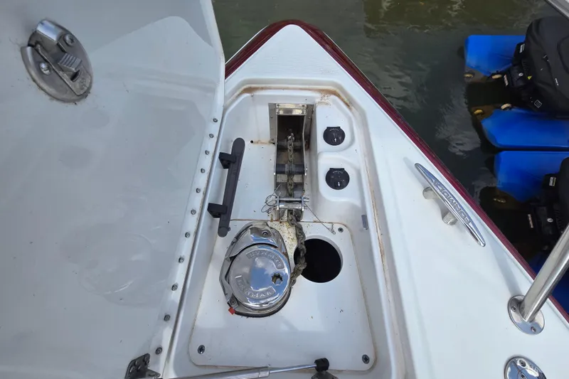 Slide: The Image of 2017 Formula 310 Sun Sport boat anchor compartment with chain and winch. - 53