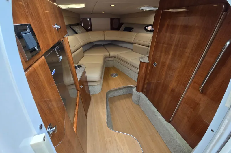Slide: The Image of Luxurious interior of 2017 Formula 310 Sun Sport boat with wood finish and leather seating. - 58