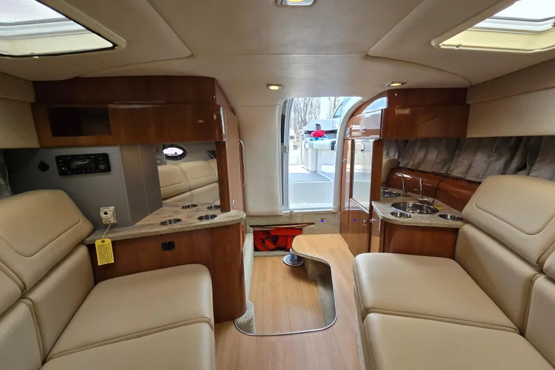 Slide: The Image of Luxurious interior of a 2017 Formula 310 Sun Sport boat with beige seating and wood accents. - 60