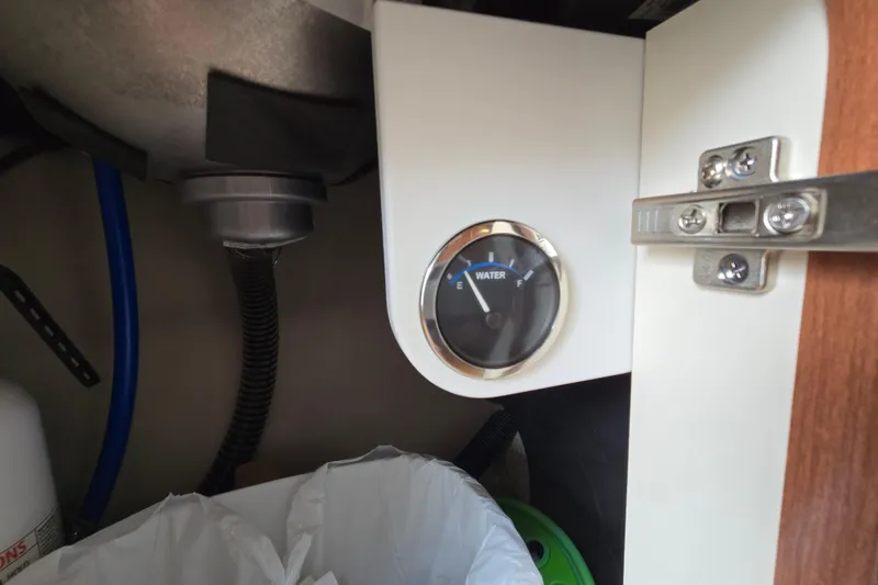 Slide: The Image of Water gauge under sink in 2017 Formula 310 Sun Sport boat. - 68