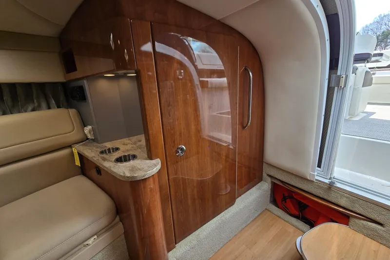 Slide: The Image of 2017 Formula 310 Sun Sport cabin interior with wood finish and seating area. - 70