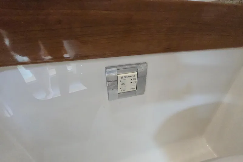 Slide: The Image of Control panel on 2017 Formula 310 Sun Sport boat interior, featuring wood and white surfaces. - 72