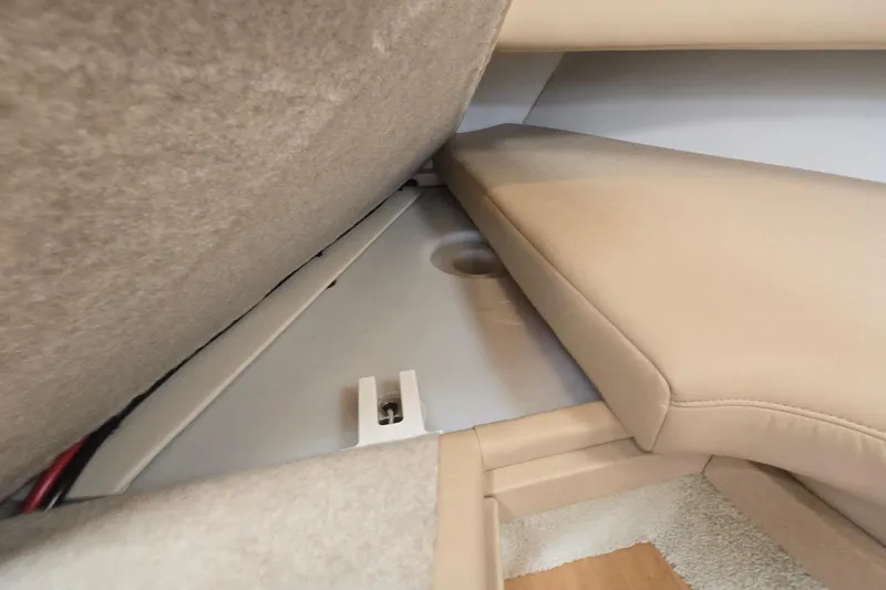 Slide: The Image of Interior view of 2017 Formula 310 Sun Sport boat, featuring beige seating and storage area. - 76