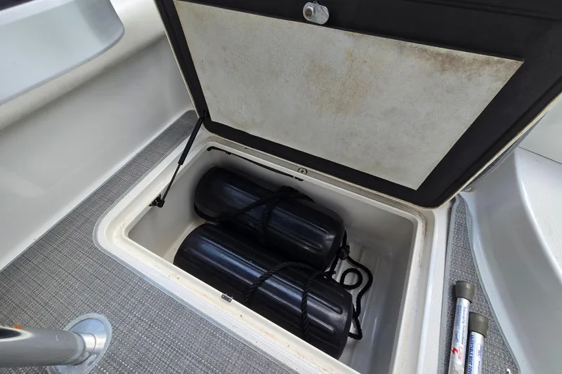 Slide: The Image of Storage compartment with black fenders on a 2017 Formula 310 Sun Sport boat. - 80