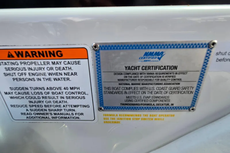 Slide: The Image of Warning and certification labels on a 2017 Formula 310 Sun Sport boat. - 81