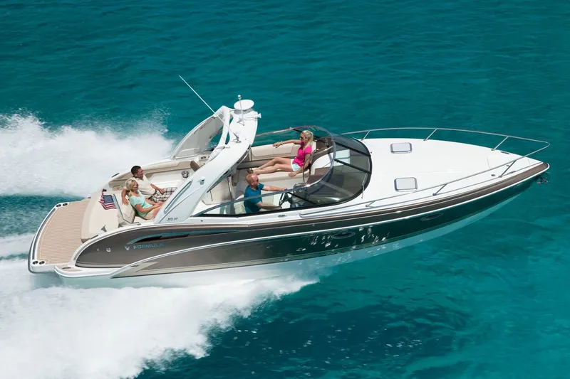 Slide: The Image of Manufacturer Provided Image: 2017 Formula 310 Sun Sport boat cruising on clear blue water. - 83