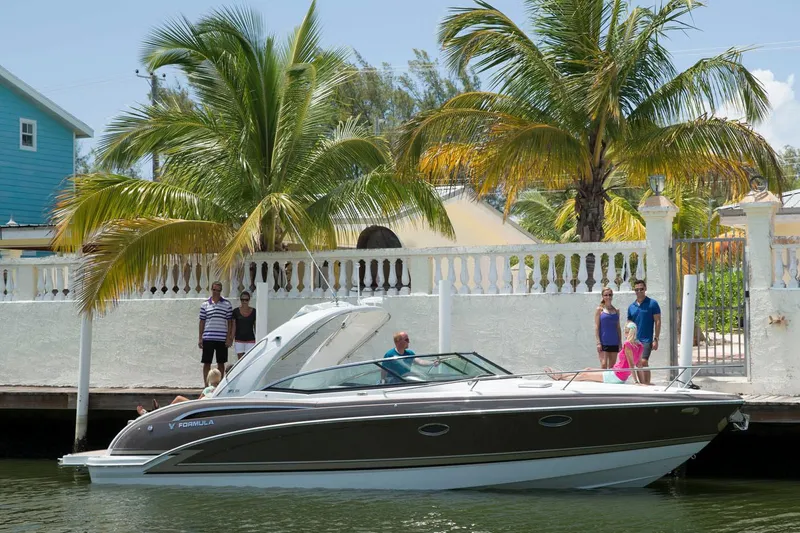 Slide: The Image of Manufacturer Provided Image: 2017 Formula 310 Sun Sport boat docked near a tropical waterfront home. - 86