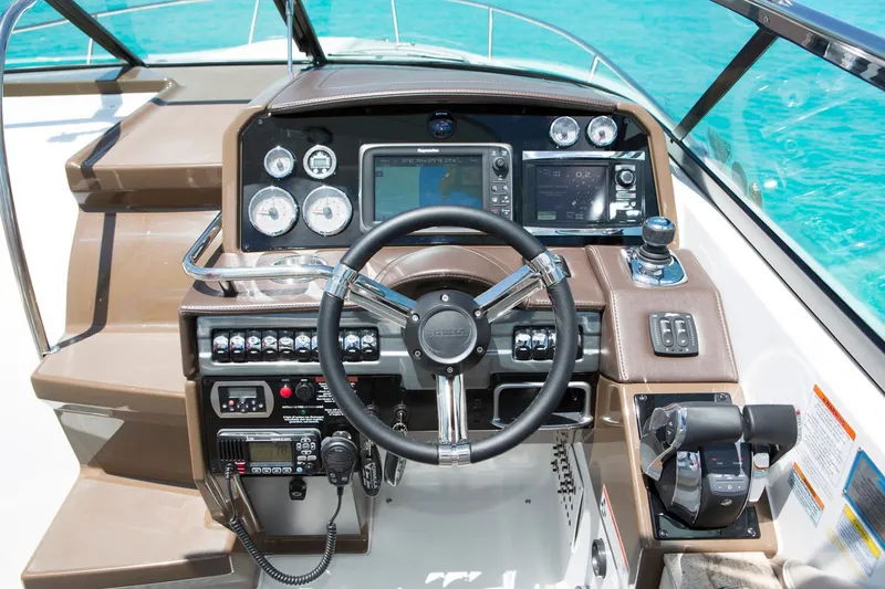 Slide: The Image of Manufacturer Provided Image: 2017 Formula 310 Sun Sport boat dashboard with steering wheel and navigation controls. - 88