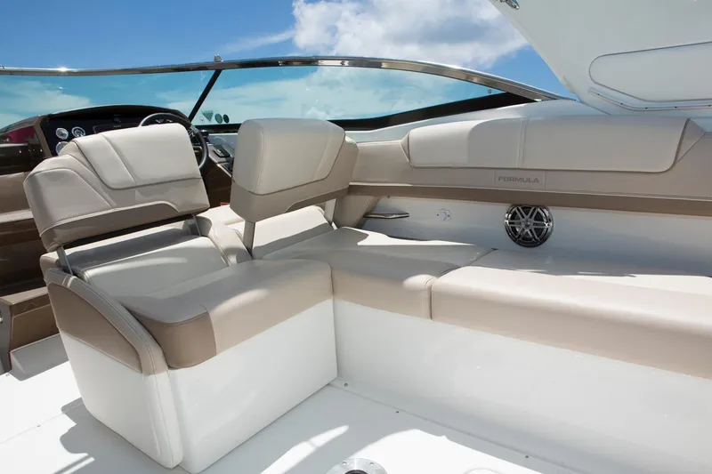 Slide: The Image of Manufacturer Provided Image: 2017 Formula 310 Sun Sport boat interior with beige seating and modern dashboard. - 89