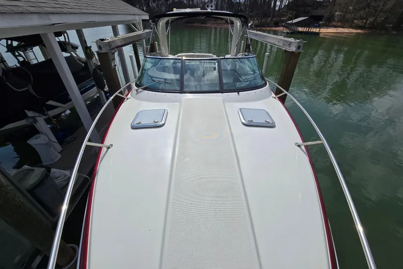 Slide: The Image of 2017 Formula 310 Sun Sport boat docked on calm water. - 9