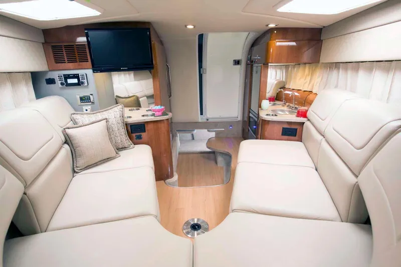 Slide: The Image of Manufacturer Provided Image: 2017 Formula 310 Sun Sport interior with beige leather seating and modern amenities. - 94