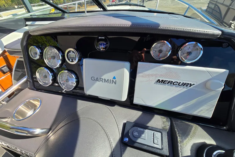 Slide: The Image of Dashboard of 2017 Formula 310 Sun Sport with Garmin and Mercury displays. - 99