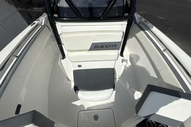 Slide: The Image of 2018 Blackfin 212 CC boat interior with white seating and sleek design. - 12