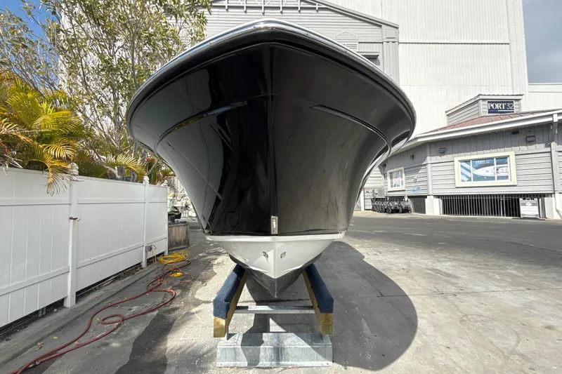 Slide: The Image of 2018 Blackfin 212 CC boat on stand, outdoor storage area, sunny day. - 17