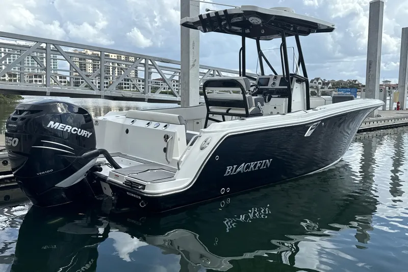 Slide: The Image of 2018 Blackfin 212 CC boat with Mercury engine docked at marina. - 22