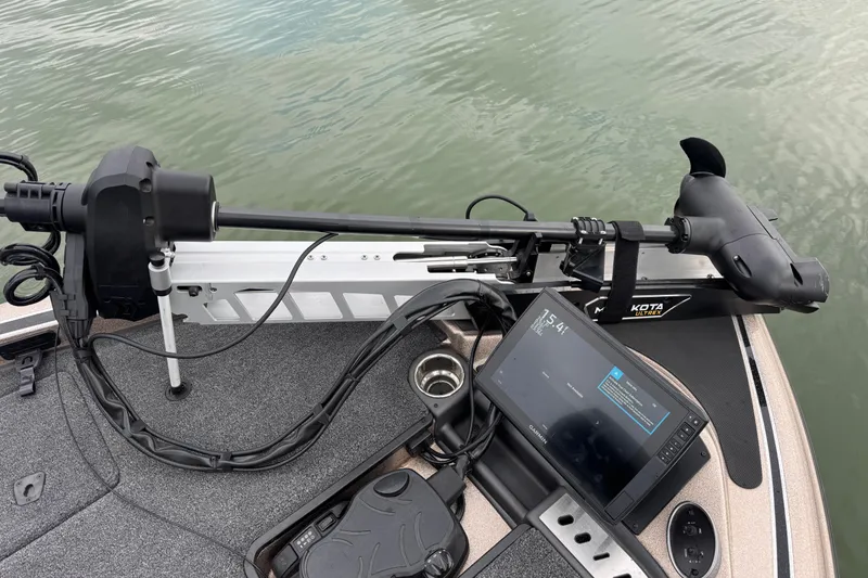 Slide: The Image of 2026 Triton 18 TrX boat with trolling motor and navigation system on water. - 10