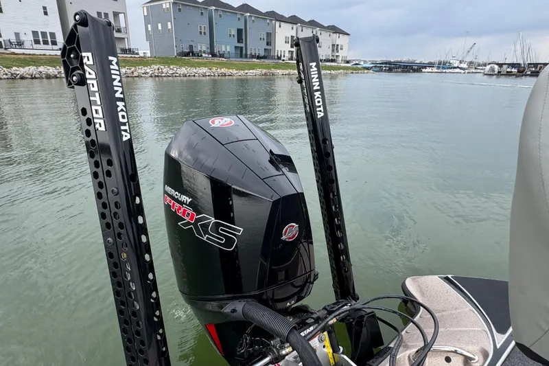 Slide: The Image of 2026 Triton 18 TrX boat with Mercury Pro XS engine and Minn Kota Raptor anchors. - 15