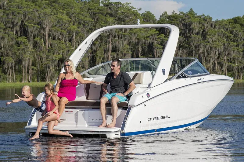 Slide: The Image of Manufacturer Provided Image: Family enjoying a day on a 2017 Regal 22 FasDeck boat on a lake. - 2