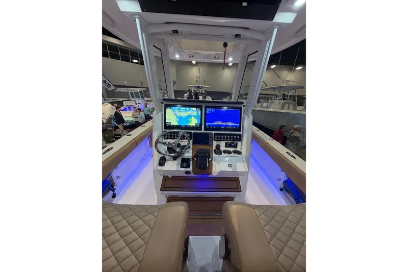 Slide: The Image of 2026 Caymas 29 CT boat cockpit with advanced navigation displays and luxurious seating. - 3