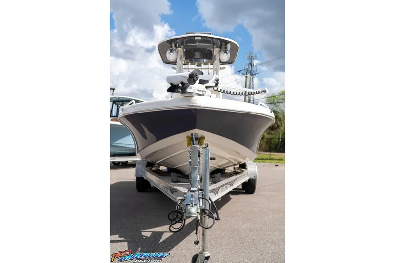 Slide: The Image of 2021 Skeeter SX2550 Family boat on trailer under cloudy sky. - 11