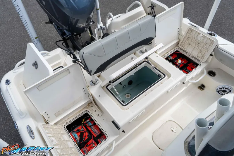Slide: The Image of 2021 Skeeter SX2550 Family boat with open storage compartments and Yamaha engine. - 20