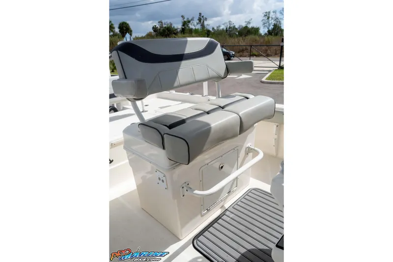 Slide: The Image of 2021 Skeeter SX2550 Family boat seat with storage, featuring sleek gray upholstery. - 22