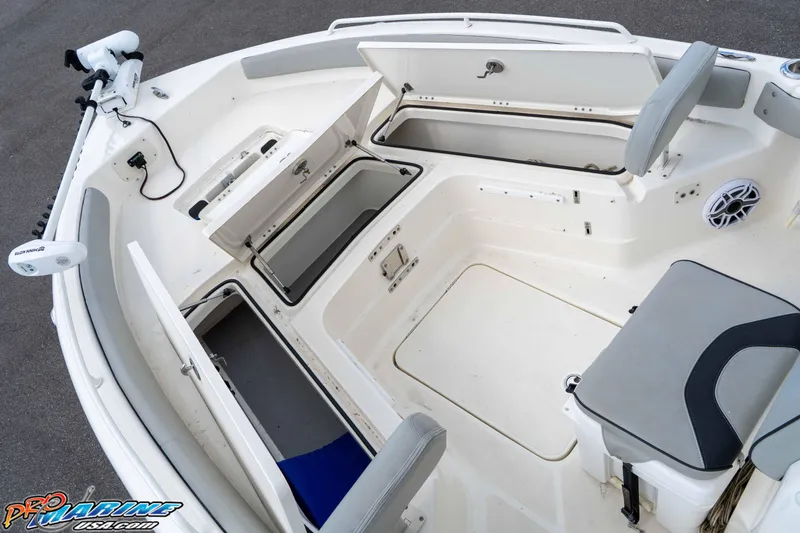 Slide: The Image of 2021 Skeeter SX2550 Family boat interior with open storage compartments and seating. - 28