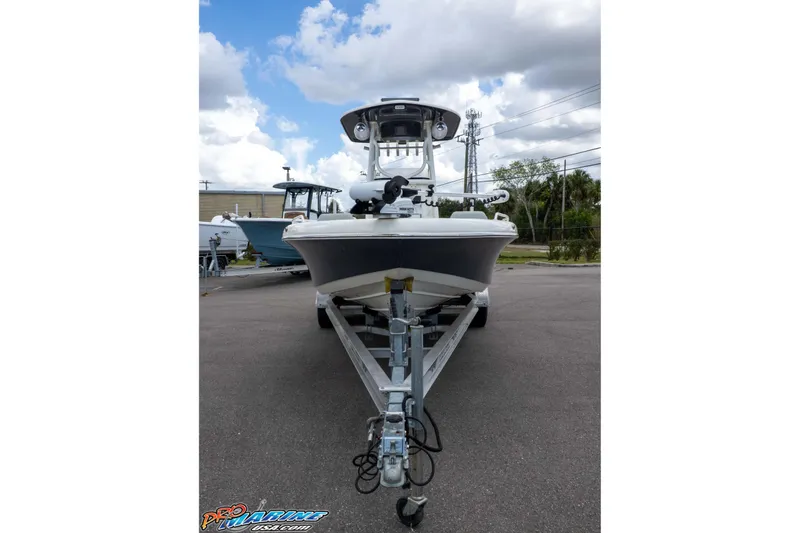Slide: The Image of 2021 Skeeter SX2550 Family boat on trailer under cloudy sky. - 33