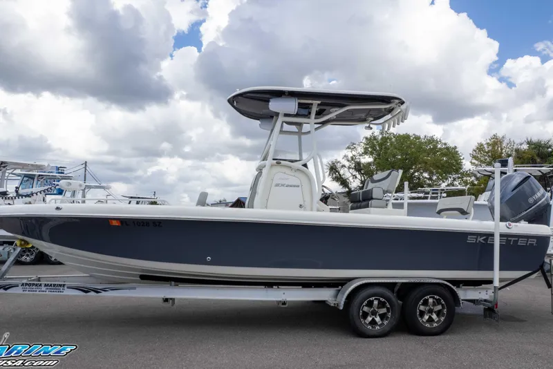 Slide: The Image of 2021 Skeeter SX2550 Family boat on trailer under cloudy sky. - 39