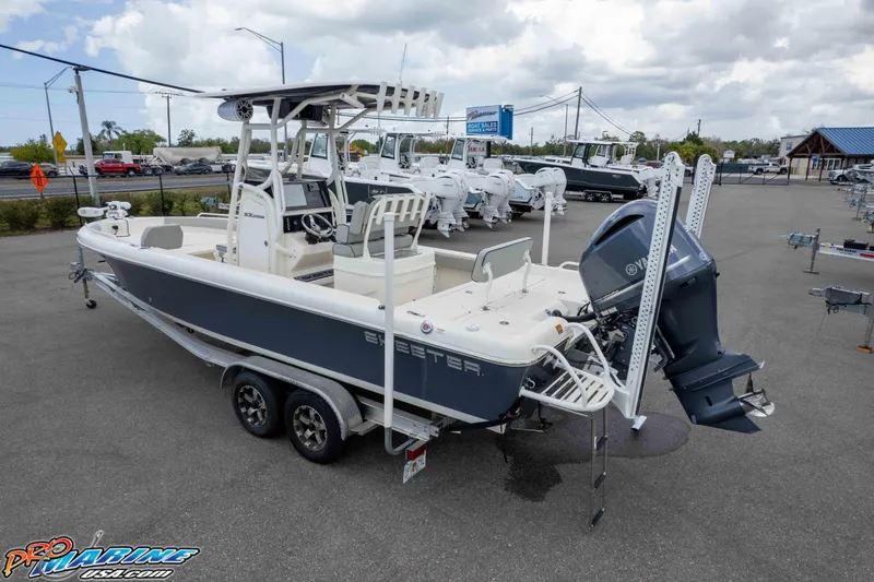 Slide: The Image of 2021 Skeeter SX2550 Family boat on trailer in dealership lot, featuring Yamaha outboard motor. - 43
