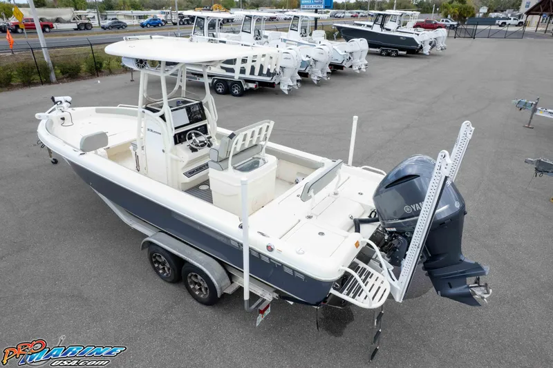 Slide: The Image of 2021 Skeeter SX2550 Family boat on trailer, featuring Yamaha outboard motor. - 44